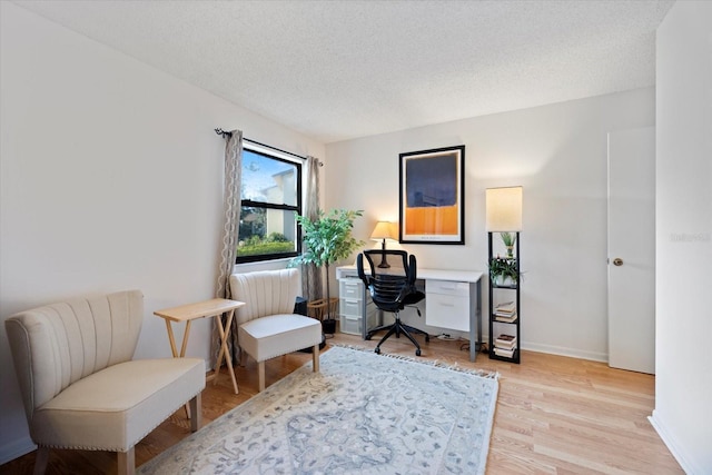 752 White Pine Tree Rd Unit 108, Venice, FL 34285 - office featuring light wood-style floors and a textured ceiling