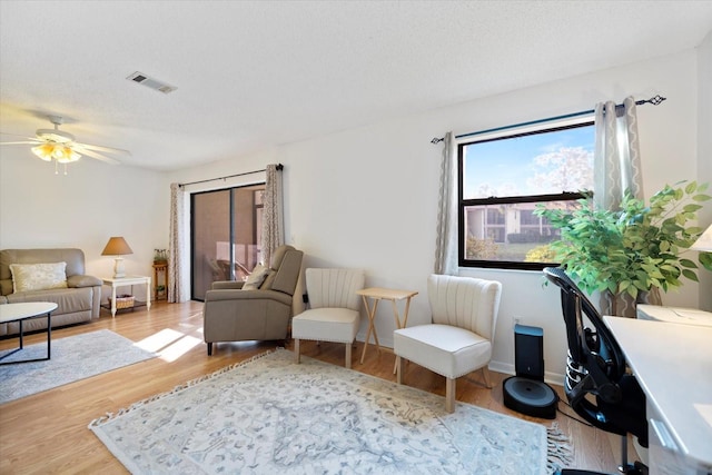752 White Pine Tree Rd Unit 108, Venice, FL 34285 - sitting room with a ceiling fan and wood finished floors