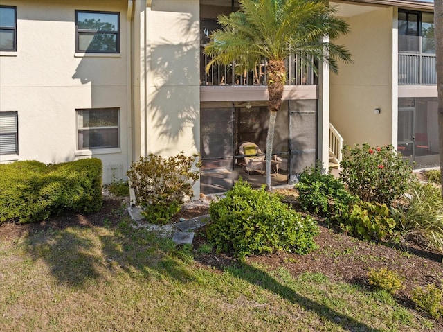 752 White Pine Tree Rd Unit 108, Venice, FL 34285 - exterior space with stucco siding and a lawn