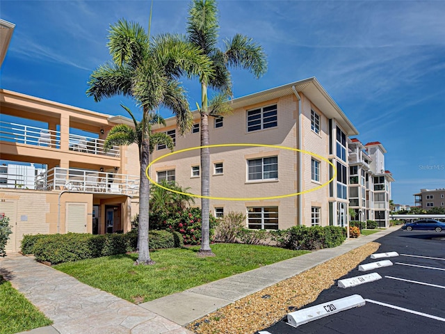200 The Esplanade N Unit B19, Venice, FL 34285 - view of building exterior with uncovered parking