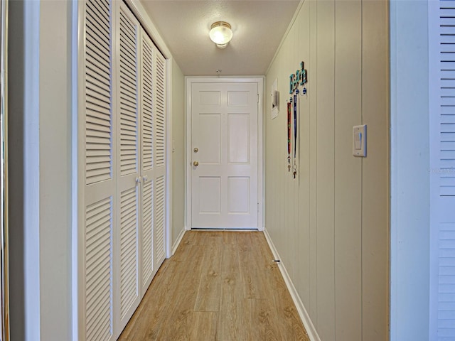 200 The Esplanade N Unit B19, Venice, FL 34285 - corridor featuring light wood-style flooring and baseboards