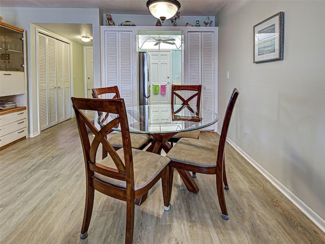 200 The Esplanade N Unit B19, Venice, FL 34285 - dining room featuring light wood finished floors and baseboards