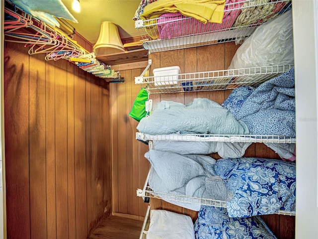 200 The Esplanade N Unit B19, Venice, FL 34285 - walk in closet featuring wood finished floors