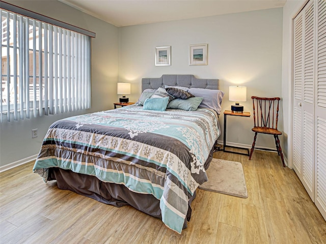 200 The Esplanade N Unit B19, Venice, FL 34285 - bedroom with wood finished floors and a closet