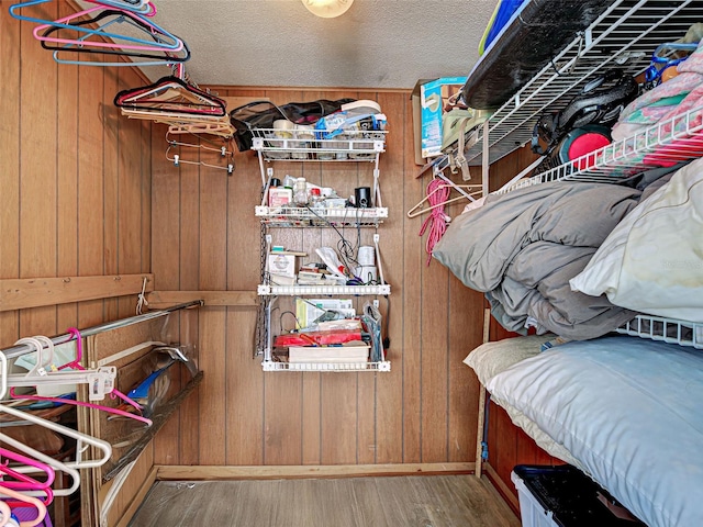 200 The Esplanade N Unit B19, Venice, FL 34285 - walk in closet featuring wood finished floors
