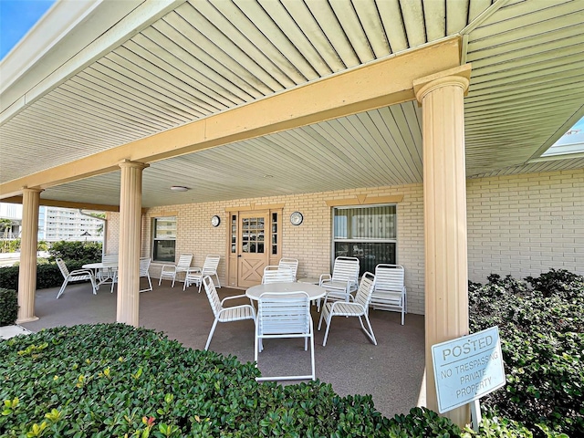 200 The Esplanade N Unit B19, Venice, FL 34285 - view of patio / terrace featuring outdoor dining space