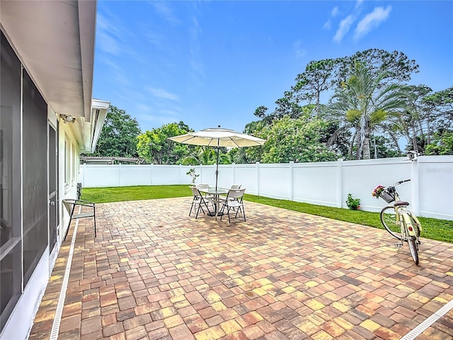 3274 Savage Rd, Sarasota, FL 34231 - fenced backyard with a patio area and outdoor dining space