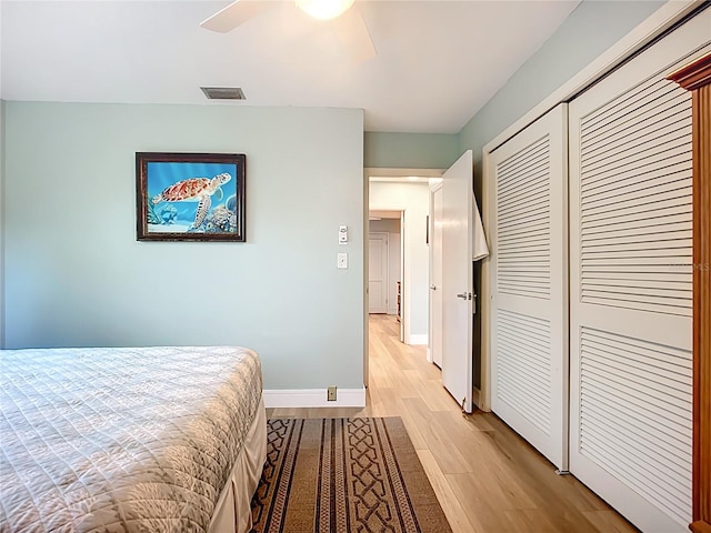 3274 Savage Rd, Sarasota, FL 34231 - bedroom featuring light wood-type flooring, a closet, and a ceiling fan