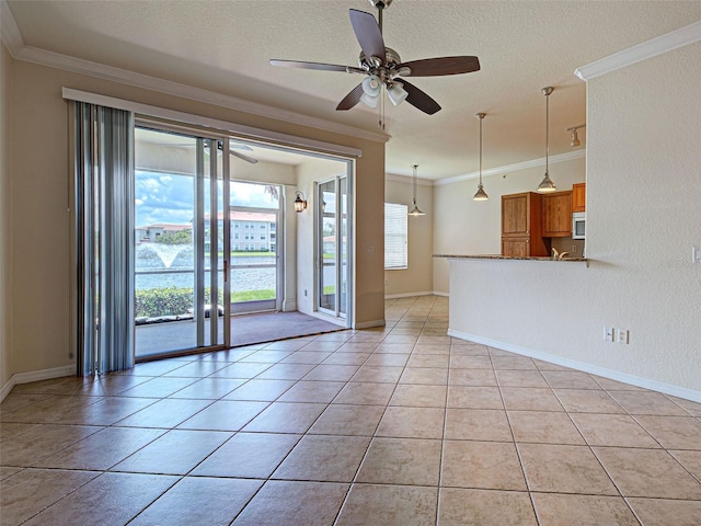800 San Lino Cir Unit 813, Venice, FL 34292 - unfurnished living room with ornamental molding, a ceiling fan, light tile patterned floors, and a textured ceiling