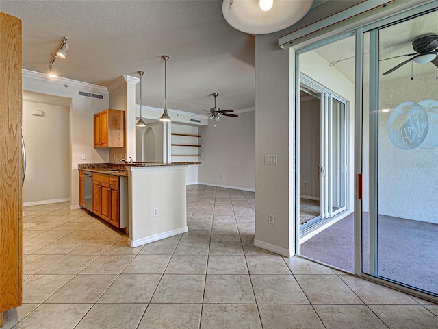 800 San Lino Cir Unit 813, Venice, FL 34292 - kitchen with ceiling fan, track lighting, crown molding, light tile patterned floors, and brown cabinets