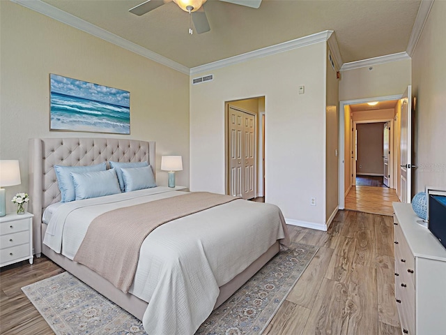 800 San Lino Cir Unit 813, Venice, FL 34292 - bedroom featuring ornamental molding, light wood-style flooring, and a ceiling fan