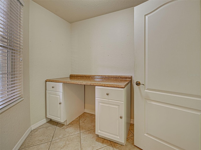 800 San Lino Cir Unit 813, Venice, FL 34292 - unfurnished office with light tile patterned floors and built in desk