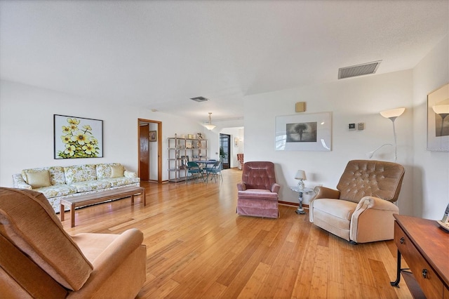 12001 Daroco Ln, North Port, FL 34287 - living area featuring light wood finished floors
