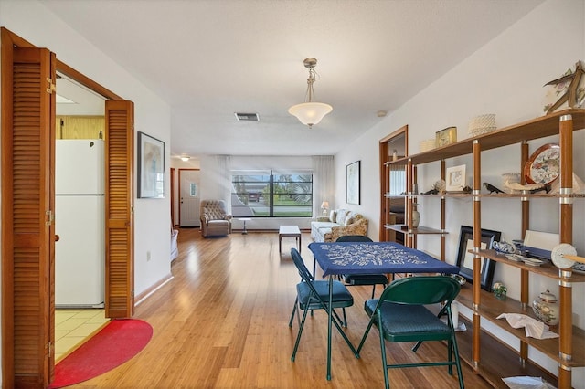 12001 Daroco Ln, North Port, FL 34287 - dining room featuring wood finished floors