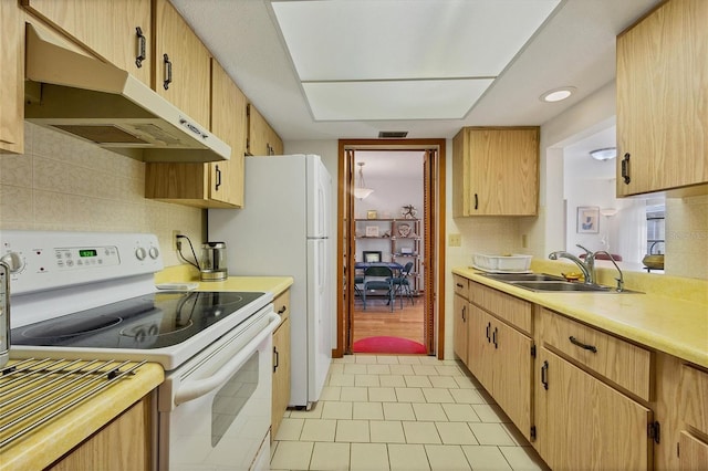 12001 Daroco Ln, North Port, FL 34287 - kitchen featuring electric stove, under cabinet range hood, light countertops, light tile patterned flooring, and tasteful backsplash