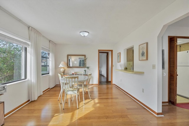 12001 Daroco Ln, North Port, FL 34287 - dining area featuring light wood-style flooring and baseboards