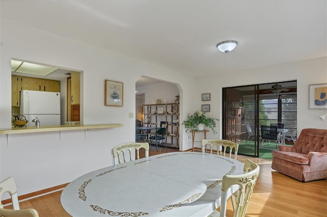 12001 Daroco Ln, North Port, FL 34287 - dining area featuring wood finished floors and arched walkways