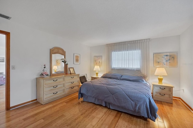 12001 Daroco Ln, North Port, FL 34287 - bedroom with light wood-style flooring and baseboards