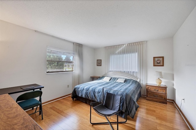 12001 Daroco Ln, North Port, FL 34287 - bedroom featuring light wood finished floors and baseboards