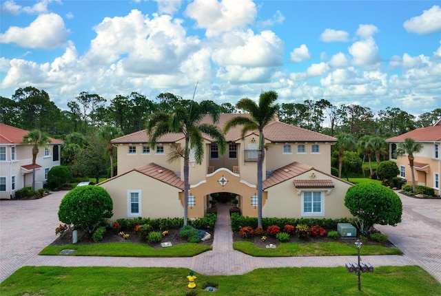 114 Bella Vista Ter Unit 6C, Nokomis, FL 34275 - mediterranean / spanish home featuring a tile roof and stucco siding