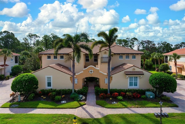 114 Bella Vista Ter Unit 6C, Nokomis, FL 34275 - mediterranean / spanish-style house featuring a tiled roof and stucco siding