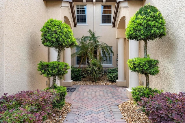 114 Bella Vista Ter Unit 6C, Nokomis, FL 34275 - view of exterior entry featuring stucco siding