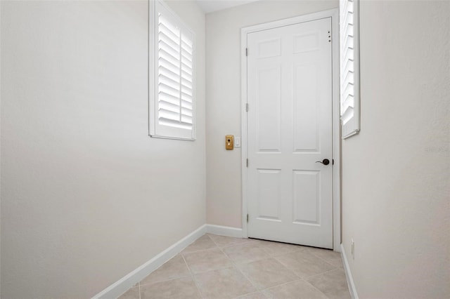 114 Bella Vista Ter Unit 6C, Nokomis, FL 34275 - doorway featuring baseboards and light tile patterned floors