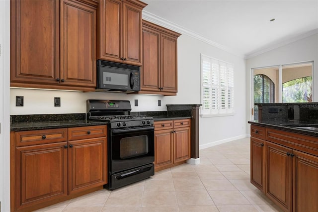 114 Bella Vista Ter Unit 6C, Nokomis, FL 34275 - kitchen with black appliances, crown molding, lofted ceiling, dark stone counters, and brown cabinetry