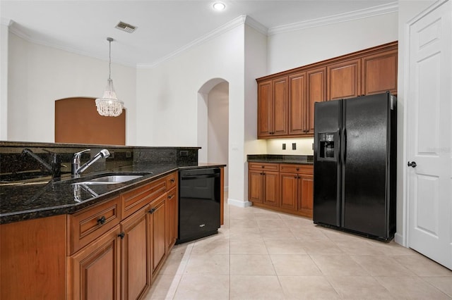 114 Bella Vista Ter Unit 6C, Nokomis, FL 34275 - kitchen with black appliances, arched walkways, ornamental molding, pendant lighting, and brown cabinets