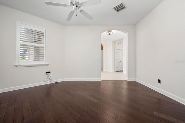 114 Bella Vista Ter Unit 6C, Nokomis, FL 34275 - spare room featuring arched walkways, ceiling fan, and wood finished floors