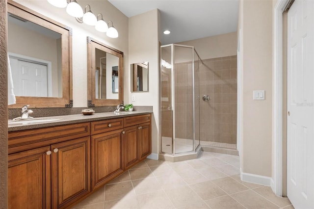 114 Bella Vista Ter Unit 6C, Nokomis, FL 34275 - full bath with tile patterned flooring, double vanity, and a shower stall