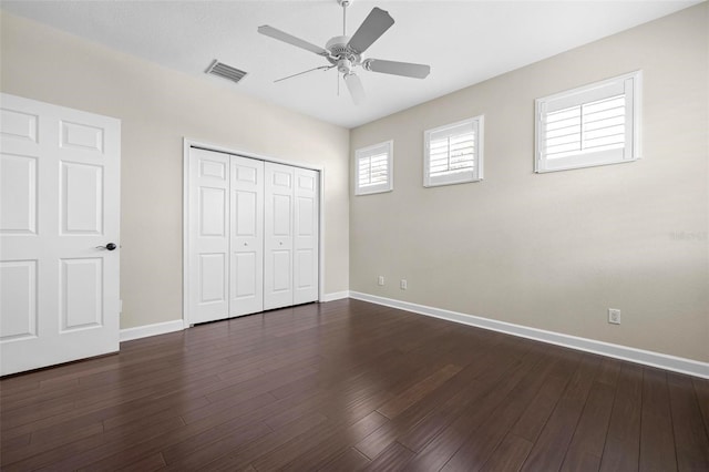 114 Bella Vista Ter Unit 6C, Nokomis, FL 34275 - unfurnished bedroom featuring a closet, dark wood-style flooring, and ceiling fan