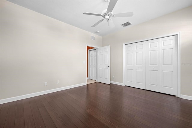 114 Bella Vista Ter Unit 6C, Nokomis, FL 34275 - unfurnished bedroom with dark wood finished floors, a closet, and ceiling fan