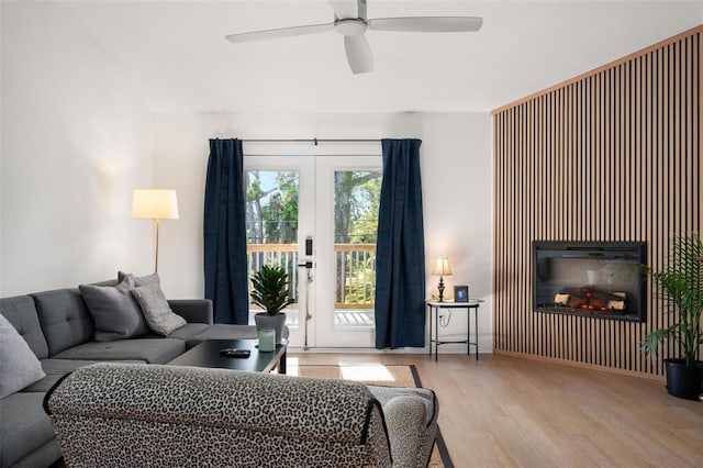 812 Garland Ave, Nokomis, FL 34275 - living room with wood finished floors, ceiling fan, and a glass covered fireplace
