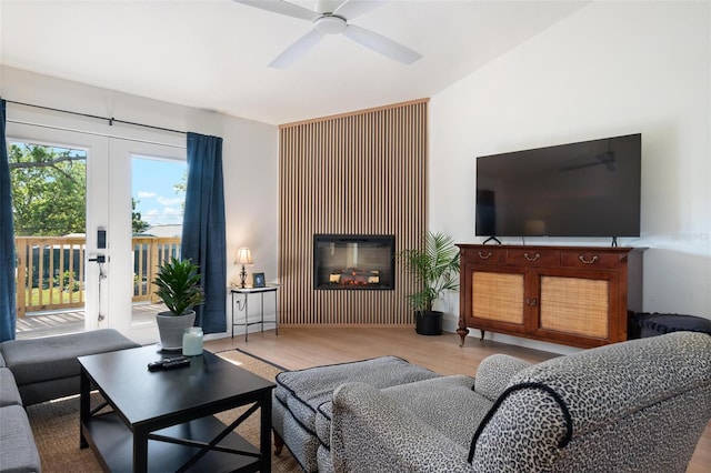 812 Garland Ave, Nokomis, FL 34275 - living area with wood finished floors, ceiling fan, and a glass covered fireplace