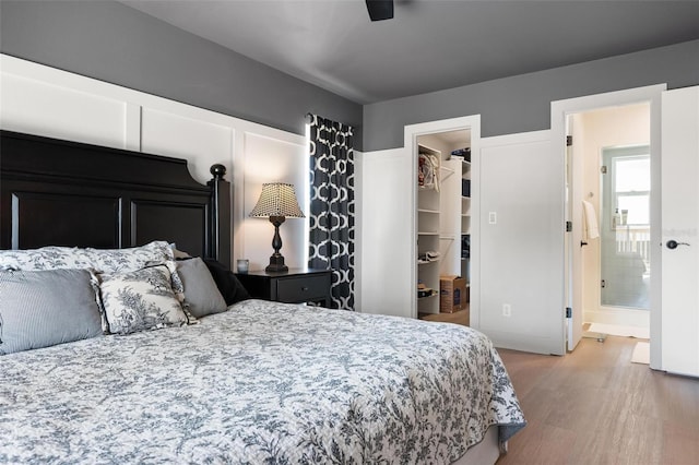 812 Garland Ave, Nokomis, FL 34275 - bedroom featuring a walk in closet and light wood-style flooring