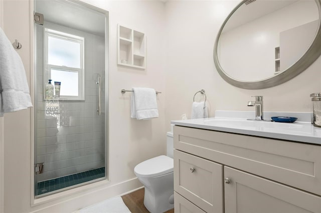 812 Garland Ave, Nokomis, FL 34275 - bathroom with vanity, a shower stall, and wood finished floors