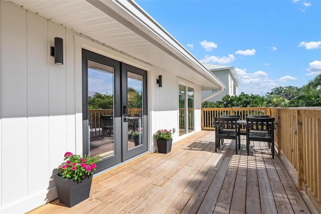 812 Garland Ave, Nokomis, FL 34275 - wooden deck featuring french doors and outdoor dining area