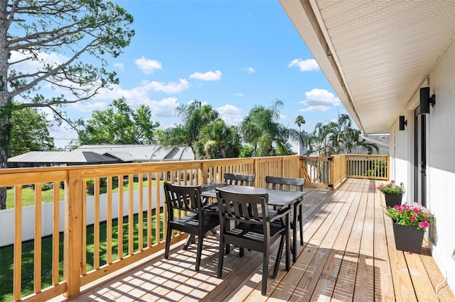 812 Garland Ave, Nokomis, FL 34275 - wooden terrace with outdoor dining space