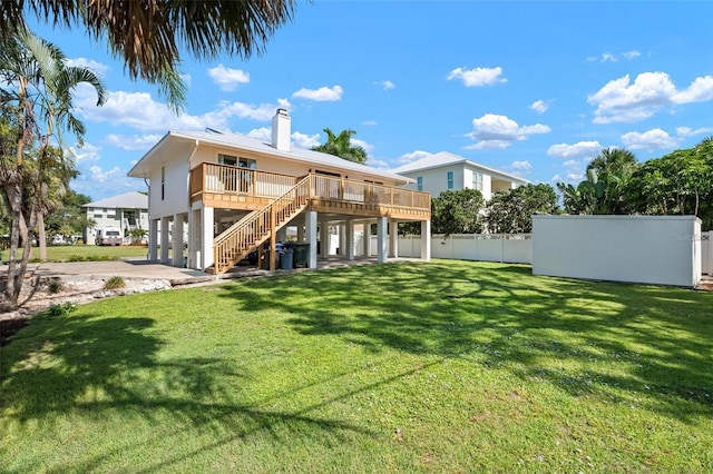 812 Garland Ave, Nokomis, FL 34275 - rear view of house featuring stairway, a carport, a chimney, a deck, and driveway
