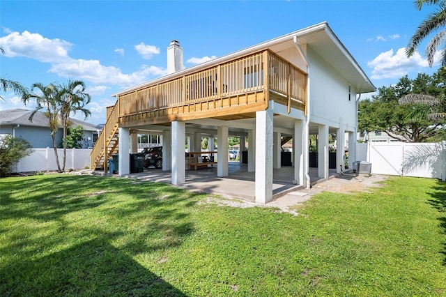 812 Garland Ave, Nokomis, FL 34275 - back of house featuring stairway, a fenced backyard, a chimney, and a patio