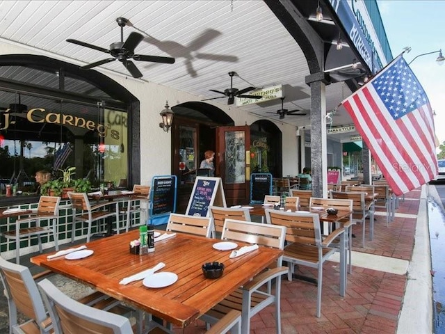 1088 Bird Bay Way Unit 307, Venice, FL 34285 - view of patio / terrace featuring outdoor dining area and ceiling fan