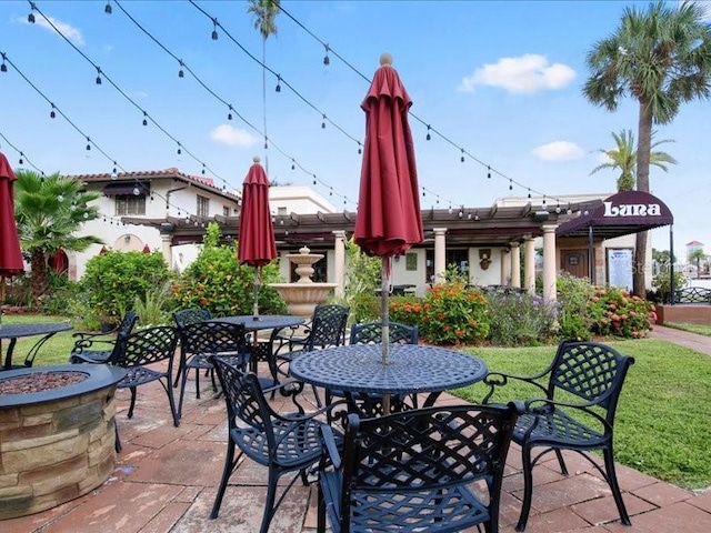 1088 Bird Bay Way Unit 307, Venice, FL 34285 - view of patio / terrace with a fire pit
