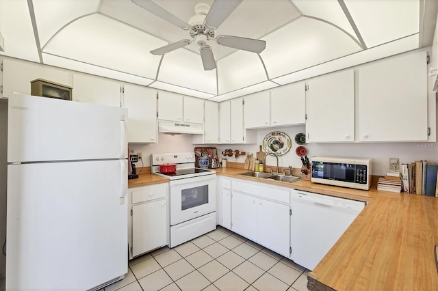 1088 Bird Bay Way Unit 307, Venice, FL 34285 - kitchen with white appliances, under cabinet range hood, light countertops, white cabinets, and a ceiling fan