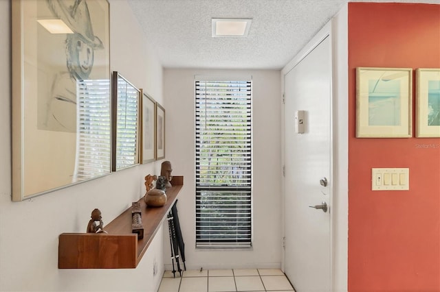 1088 Bird Bay Way Unit 307, Venice, FL 34285 - entrance foyer featuring a textured ceiling and tile patterned flooring