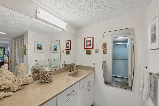 1088 Bird Bay Way Unit 307, Venice, FL 34285 - full bathroom with a textured ceiling and vanity