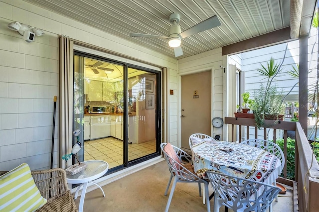 1088 Bird Bay Way Unit 307, Venice, FL 34285 - sunroom featuring a ceiling fan and outdoor dining space