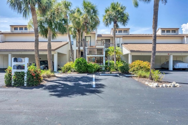 1088 Bird Bay Way Unit 307, Venice, FL 34285 - view of building exterior with covered and uncovered parking