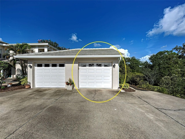 903 Addington Ct Unit 203, Venice, FL 34293 - garage with concrete driveway
