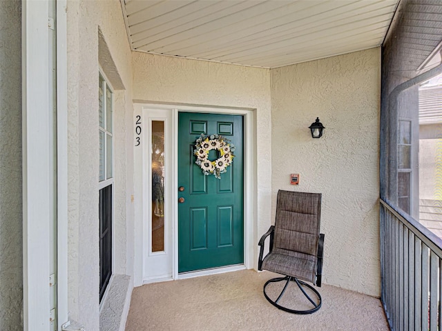 903 Addington Ct Unit 203, Venice, FL 34293 - doorway to property featuring stucco siding